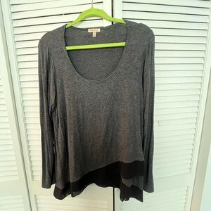 Grey and black long sleeve scoop neck top with asymmetrical front hem. Medium